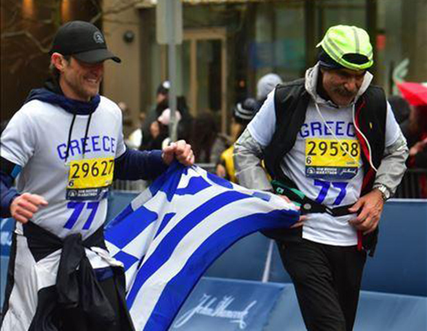 Jimmy and Mike crossing the Boston Marathon finish line in the same jersey worn by 1946 Boston Marathon champion Stylianos Kyriakides