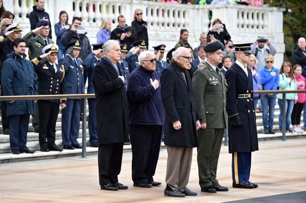 Laying a wreath at Arlington National Cemetary’s Tomb of the Unknowns in tribute to those who lost their lives in WWII