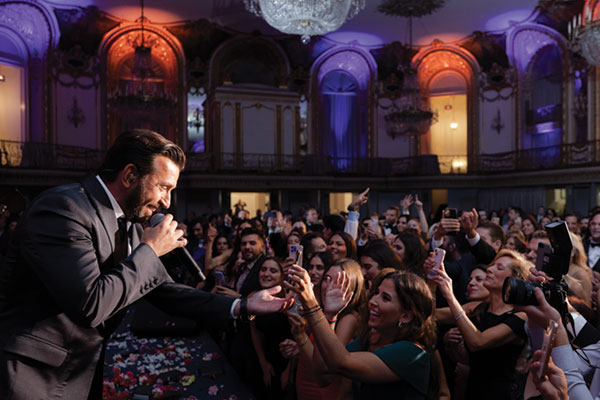 Greek singer Thanos Petrelis performs at the NHM Gala. Photo by Gold Grid Studios