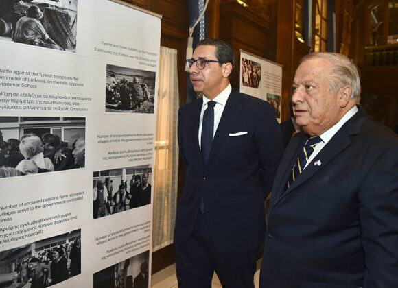 Foreign Minister Kombos and Philip Christopher review the special photo exhibit on the 50th dark anniversary of the invasion and occupation of Cyprus